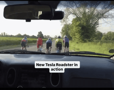 Cyclists Riding With New Tesla Roadster In Action GIF