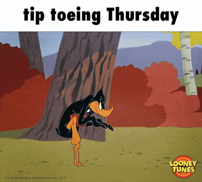 Daffy Duck Tiptoeing Thursday Next To Tree GIF