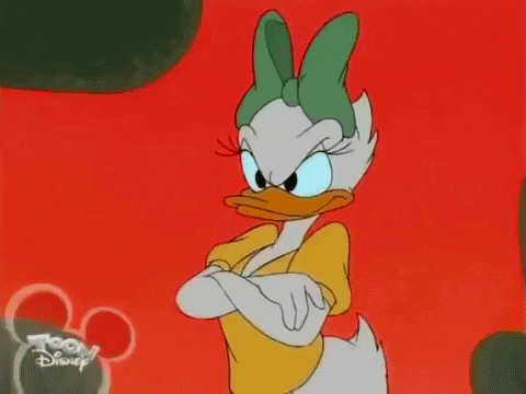 Daisy Duck Is Standing With Her Arms Crossed And Looking Angry In A Cartoon . GIF
