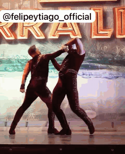 Dancers Dancing In Front Of @Felipetytiago_official Sign GIF