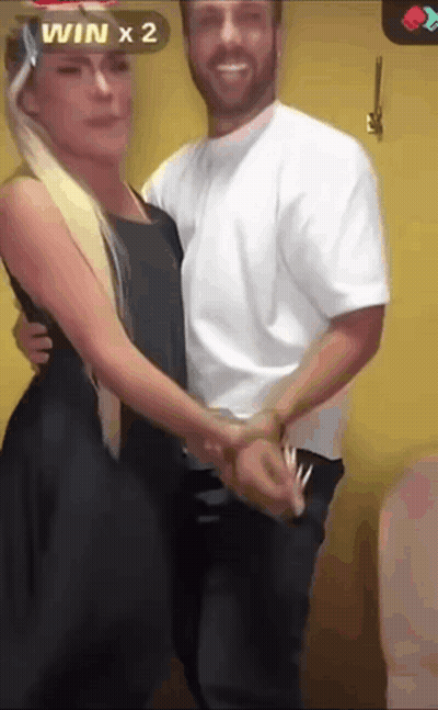 Dancing Couple Yellow Wall Win X 2 GIF