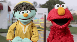 Dancing Elmo Together With Raya In The Street GIF
