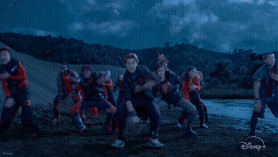 Dancing Group In Blue Sky With Disney Logo GIF