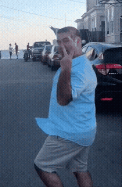 Dancing Man In Blue Shirt And Khaki Shorts GIF