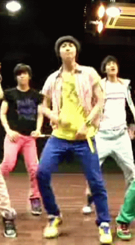 Dancing Men On Stage Yellow Shirt Number 2 GIF