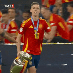 Dani Olmo Proudly Strolls With Trophy GIF