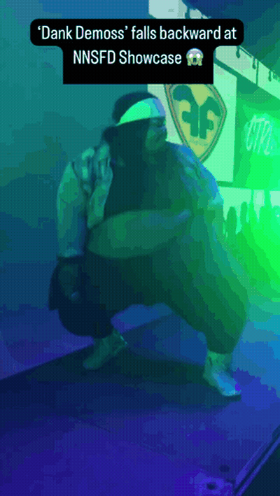Dank Demoss Falls Backward At NNSFD Showcase Purple Background GIF