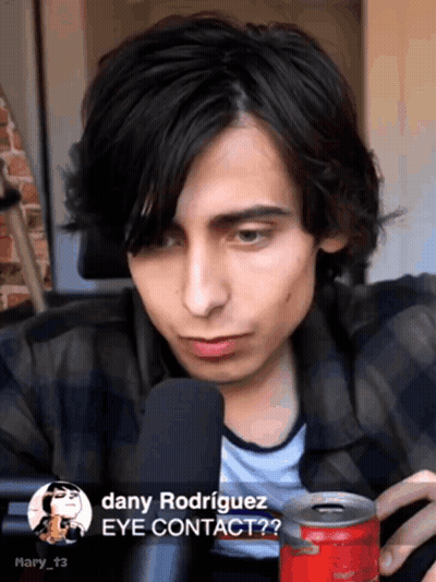 Dany Rodriguez Talking Into Microphone Holding Coke GIF
