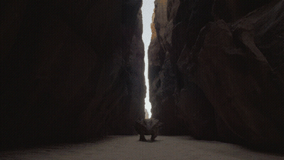 Dark Canyon With Rock In Middle GIF
