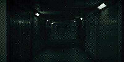 Dark Hallway With Lights On Walls GIF