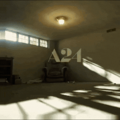 Dark Room With A24 On Wall GIF