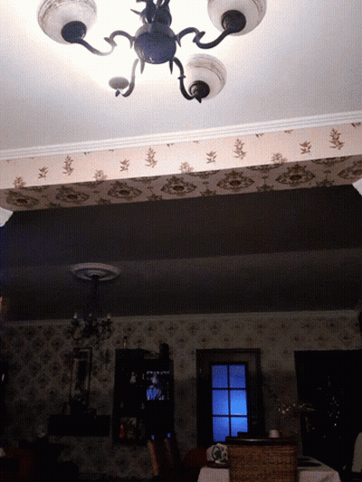 Dark Room With Chandelier And Window GIF