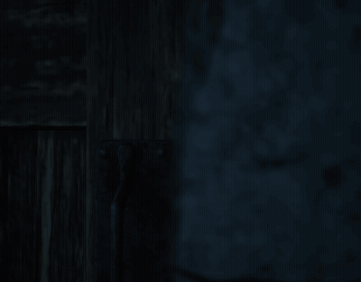 Dark Room With Wooden Shelf And Brick Wall GIF