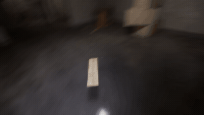 Dark Room With Wooden Table And Light On Floor GIF