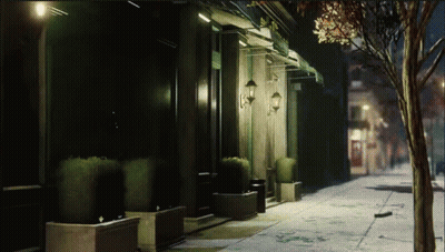 Dark Street With Building And Green Awning GIF