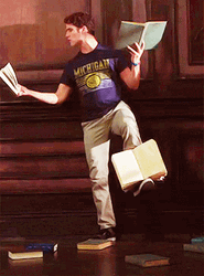 Darren Criss Multitasking With Books GIF