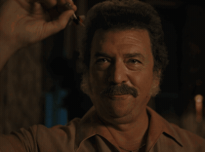 Dart Board With Three Darts In Bullseye GIF