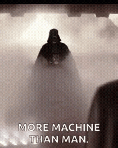 Darth Vader From Star Wars Is Standing In The Fog And Says `` More Machine Than Man '' . GIF