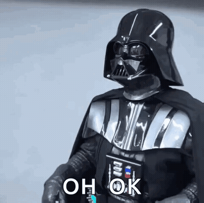 Darth Vader From Star Wars Is Wearing A Helmet And Cape And Holding A Light Saber . GIF