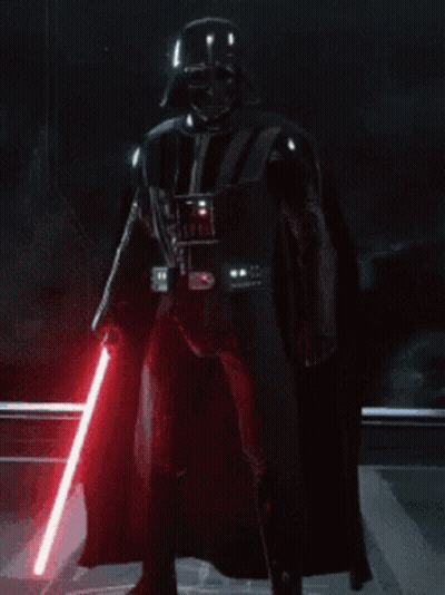 Darth Vader Is Holding A Red Lightsaber In A Dark Room GIF