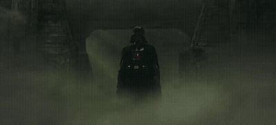 Darth Vader Is Holding A Red Lightsaber In The Fog . GIF