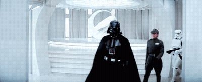 Darth Vader Is Standing In A Room With Stormtroopers . GIF