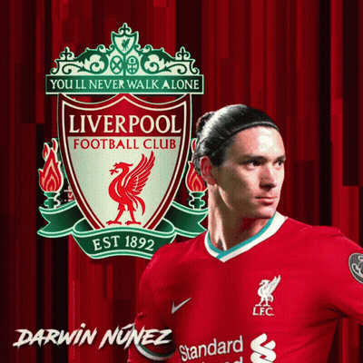 Darwin Nunez Stands In Front Of A Liverpool Football Club Poster GIF
