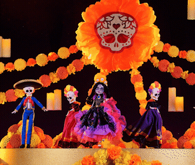 Day Of The Dead Dolls In Front Of Skull Flower GIF