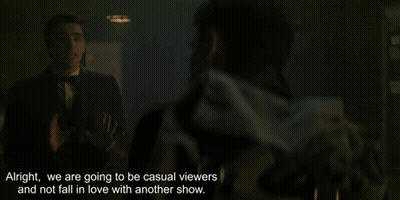 Dead Boy Detectives Poster With Statue GIF