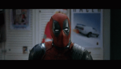 Deadpool Costume Man In Front Of Wall Poster Saying So GIF