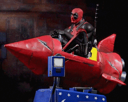 Deadpool Dance Riding Rocket Ship Toy Machine GIF