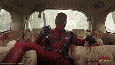Deadpool Is Sitting In The Back Seat Of A Car With A Knife In His Hand GIF