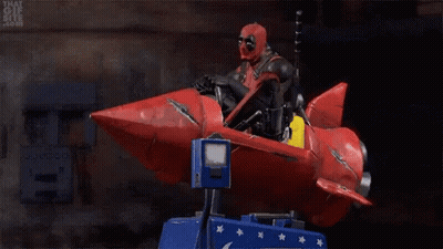 Deadpool Riding Red Rocket On Carousel GIF