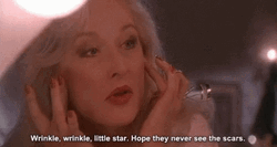 Death Becomes Her Madeline Ashton Looking At Wrinkles GIF