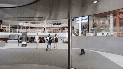 Decathlon Store In Mall With People Walking GIF