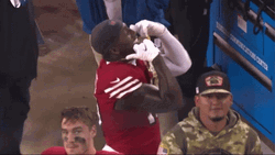 Deebo Samuel Showing Off Medal GIF