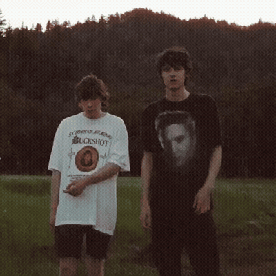 Deer Standing Next To Rabbit In Field GIF