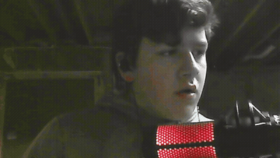 Demon With Red Eyes And Horns In Dark GIF