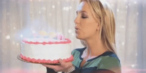 Demure Britney Spears Holding A Cake GIF