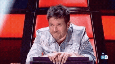 Denim Jacket Man Hands Folded On Red Chair GIF