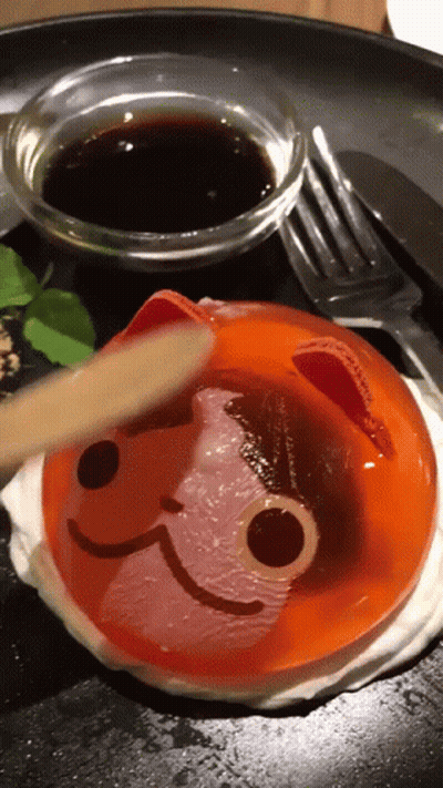 Dessert With Cat Face And Bowl Of Sauce GIF