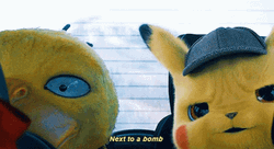 Detective Pikachu Sitting Next To Psyduck GIF