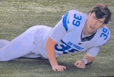 Detroit Football Player Laying On Field GIF