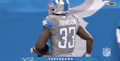 Detroit Lions Football Player Holding A Football GIF