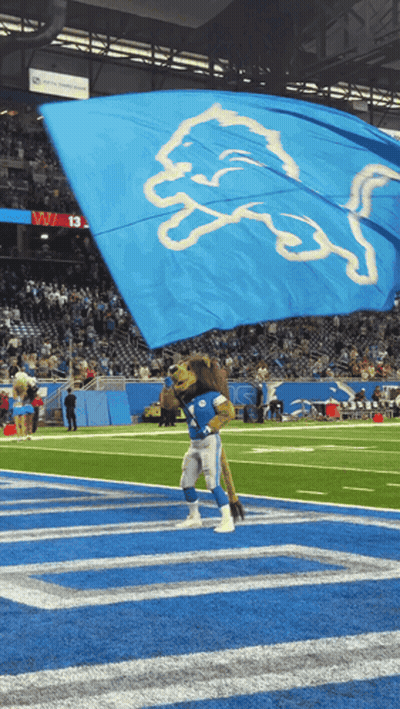 Detroit Lions Mascot Waving Blue Flag GIF
