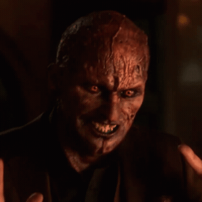 Devil Face Close Up With Hand Reaching Out GIF