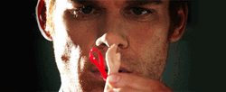 Dexter Morgan Checking Out Doll Hand GIF