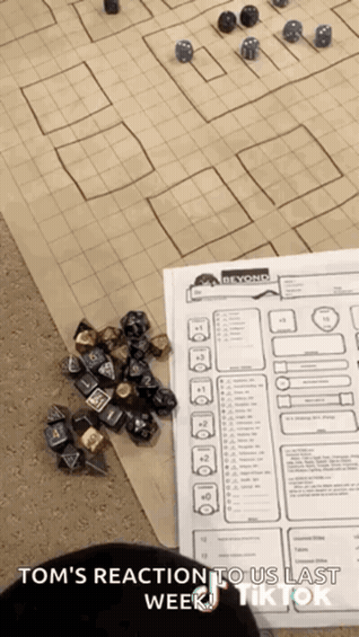 Dice on Table Next to Paper Saying Beyond