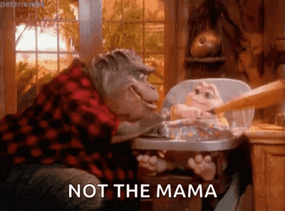 Dinosaur Feeding Baby In High Chair Saying Not The Mama GIF