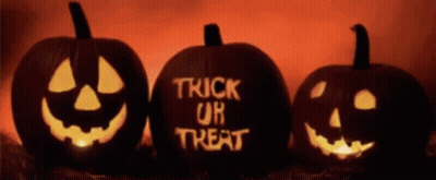 Dinosaur In Pumpkin Bucket Holding Lollipop Saying Trick Or Treat GIF